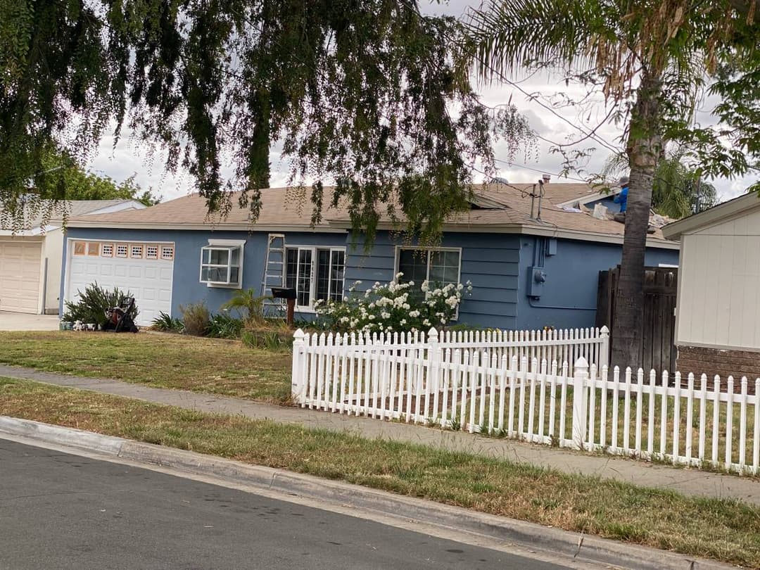 freshly installed white picket fence